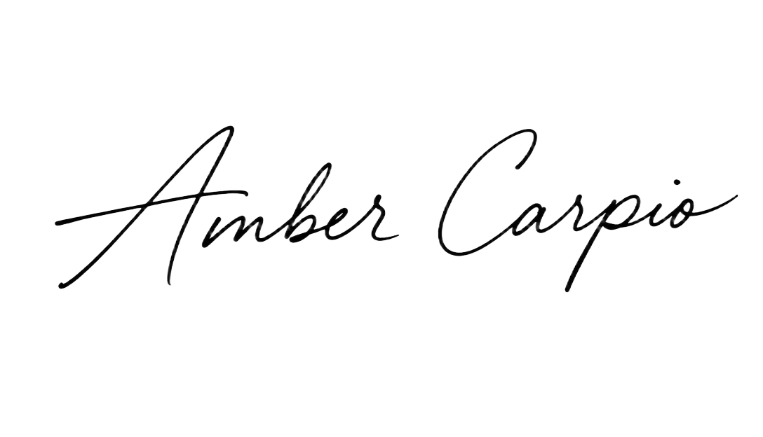 Handwritten signature of Amber Carpio